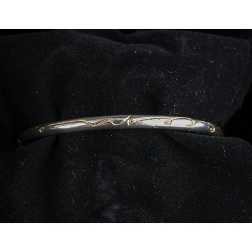 56 - Diana Porter silver bangle and three rings. Two diamond set hallmarked silver rings together with an... 