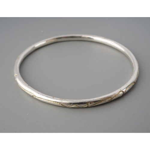 56 - Diana Porter silver bangle and three rings. Two diamond set hallmarked silver rings together with an... 