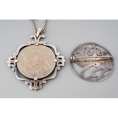 57 - Hallmarked silver circular dragon brooch together with a 1977 commemorative coin set in white metal ... 