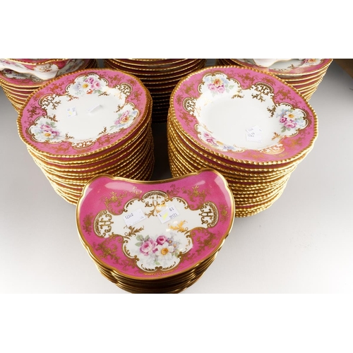 908 - An extensive Limoges (D&C/L Bernaudaud & Co) part dinner service, scalloped gilt edges with Pompadou... 