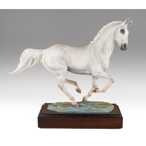 An Albany Fine China Co limited edition model of Desert Orchid, modelled by Lorne McKean, factory marks to his underside, on wooden base, approx 34cm to top of ear

Desert Orchid, known as Dessie, was an English racehorse who famously amongst many Grade I races won the Cheltenham Gold Cup in 1989.