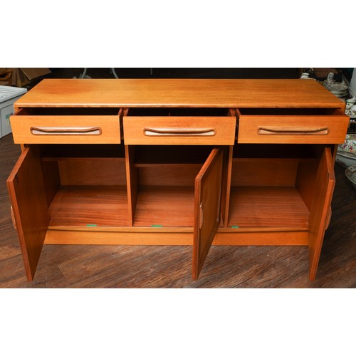 1025 - A teak G Plan Fresco sideboard. fitted with three frieze drawers and three cupboards, each cupboard ... 