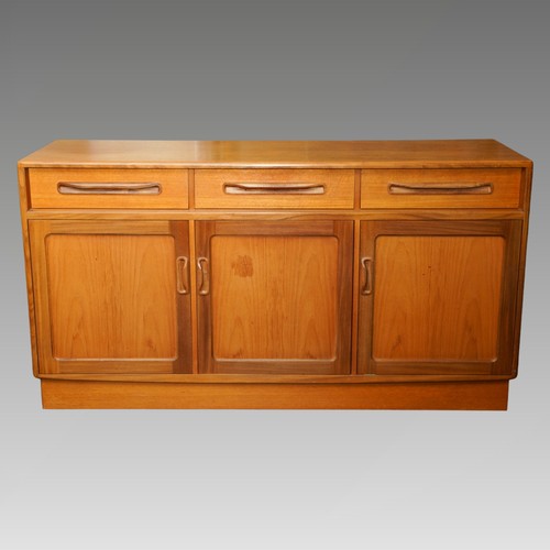 1025 - A teak G Plan Fresco sideboard. fitted with three frieze drawers and three cupboards, each cupboard ... 