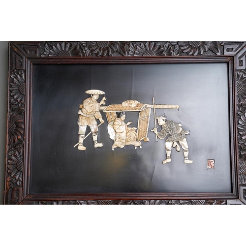 66 - Two early 20th century Japanese shibayama panels in foliate carved frames, one depicting two male fi... 