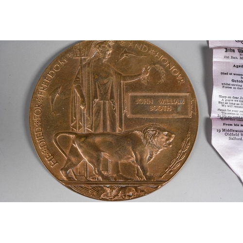 87 - A World War I death penny/plaque awarded to John William Booth, comes with a silk In Loving Memory b... 