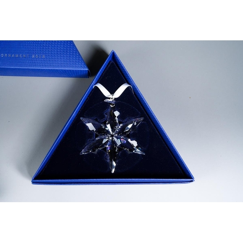 384 - Two boxed Swarovski Christmas bauble sets, comprising 2015 Ornament and 2016 set of three stars [2]