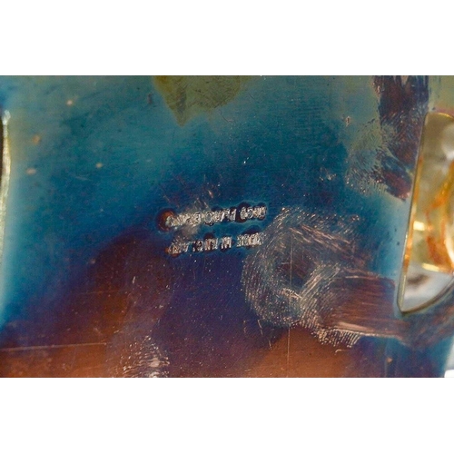 386 - An early 20th Century silver plate inkwell with gallery rail on bun feet with a pair of glass inkbot... 