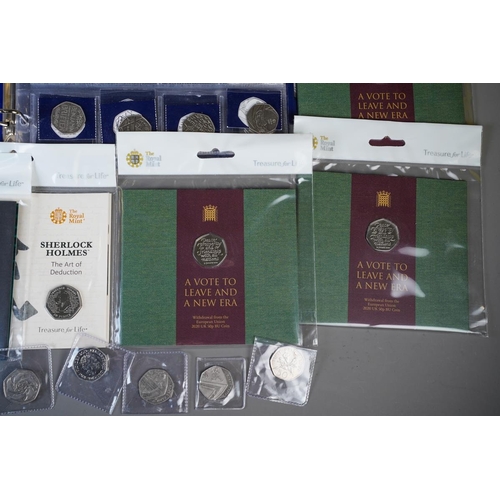 389 - A Coin Checker folder containing approximately seventy legal tender 50p coins, mostly picture backs,... 