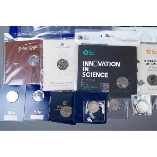 389 - A Coin Checker folder containing approximately seventy legal tender 50p coins, mostly picture backs,... 