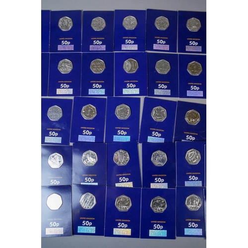 391 - A collection of UK picture back 50p pieces in Change Checker packs, comprising twenty-one dinosaur t... 