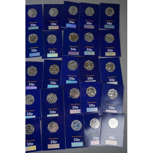 391 - A collection of UK picture back 50p pieces in Change Checker packs, comprising twenty-one dinosaur t... 