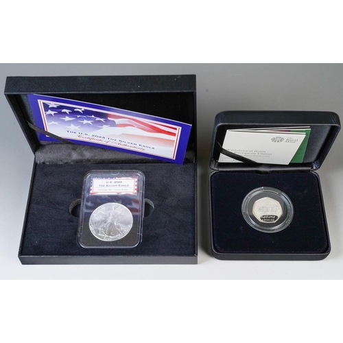 392 - A boxed and cased 2024 U.S. 1oz silver eagle coin in perspex case, with certificate, together with a... 