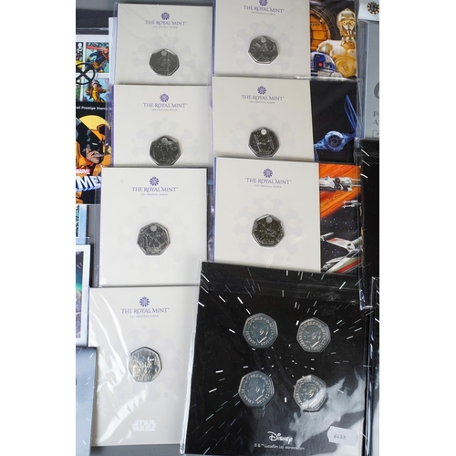 393 - A small collection of coins and stamps relating to popular culture / TV / Film, including a Marvel X... 