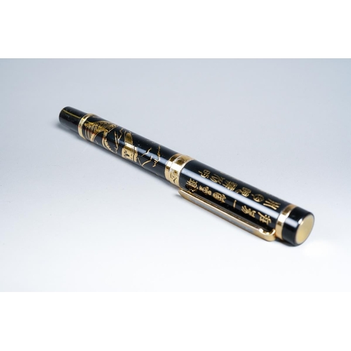 414 - A boxed Chinese Jinhao black and gilt metal Fountain Pen, the barrel decorated with landscape, the c... 