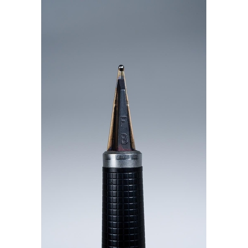 415 - A Parker 180 gold plated fountain pen, the barrel and cap engine turned with dot decoration, the nib... 