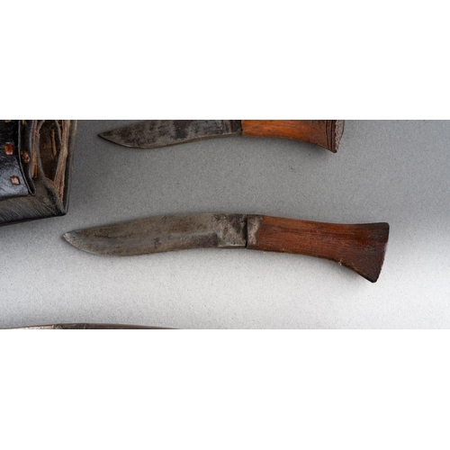 4 - A Kukri with wooden grip and steel blade, in leather scabbard with two skinning knives [1]