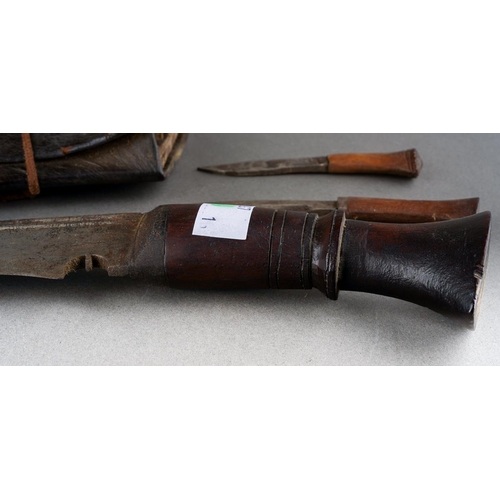 4 - A Kukri with wooden grip and steel blade, in leather scabbard with two skinning knives [1]