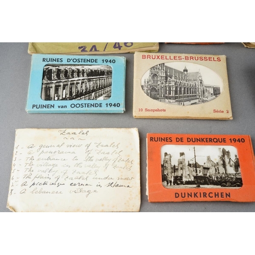 44 - A small group of World War Two memorabilia including black and white postcard packs from the 1940s O... 
