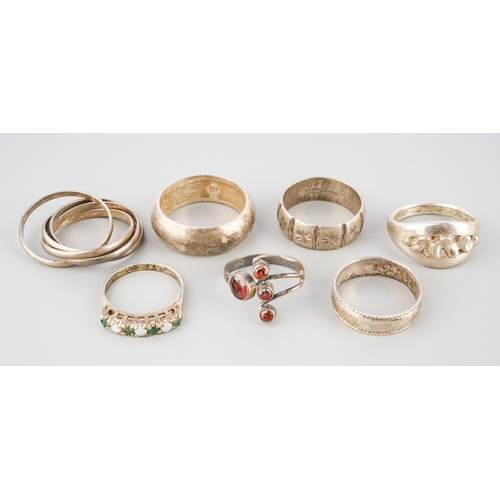 A group of white metal rings. To include seven rings, each ring with ...