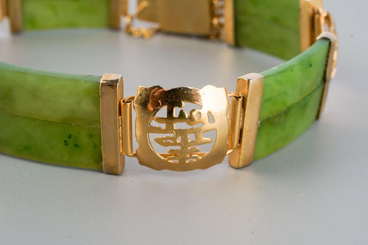 A Far Eastern jade bracelet. The double nephrite jade panels ...
