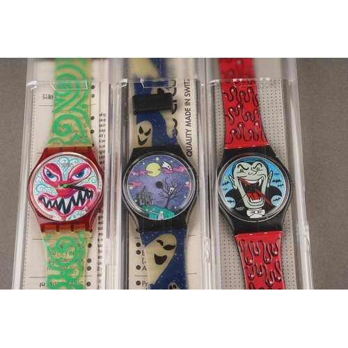 Three boxed 1990s Swatch themed watches including Dracula, Monster Time ...
