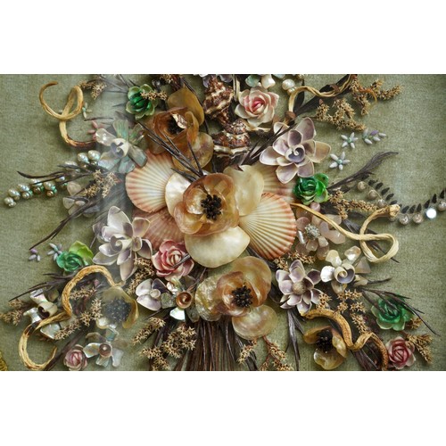 37 - A late 20th Century oval gilt framed shell picture, in the form of a bouquet of flowers, bears shell... 