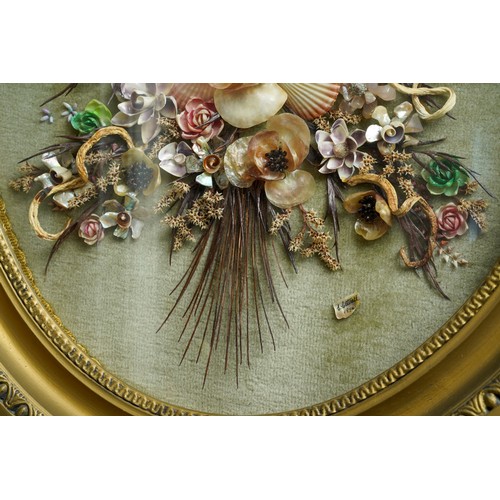 37 - A late 20th Century oval gilt framed shell picture, in the form of a bouquet of flowers, bears shell... 