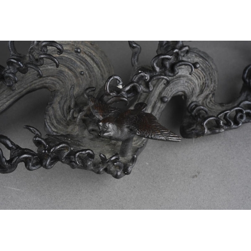 44 - A two section bronze centrepiece, the upper section of circular form with internal thread, the base ... 