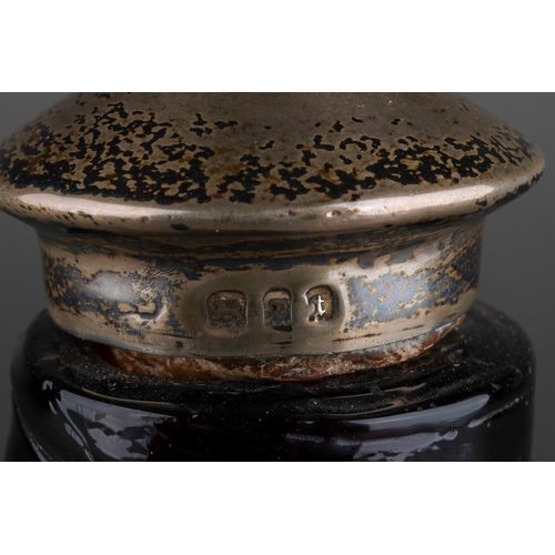 57 - A 19th Century amber glass flagon with loop handle, the cork with a later silver mounted cork hallma... 