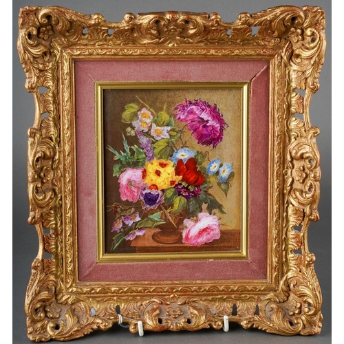 An early 19th century English porcelain plaque of a still life of flowers in a vase on a table, the back bears hand written paper label over exposed porcelain "Derby Plaque by Moses Webster", plaque size 15cm x 12.5cm, in a mount and frame, frame size 28.5cm x 26cm, approx