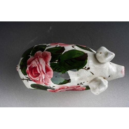 244 - An early 20th Century small Wemyss Ware Cabbage Roses Pig, circa 1900, impressed WEMYSS under right ... 