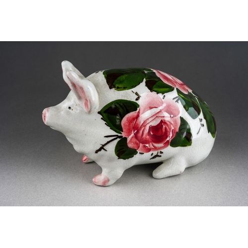 244 - An early 20th Century small Wemyss Ware Cabbage Roses Pig, circa 1900, impressed WEMYSS under right ... 