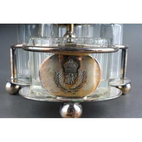 257 - An early 20th Century silver plate quatre foil shaped Officers Mess cruet stand with loop handle, th... 