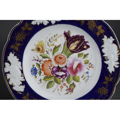265 - Two early 19th century English porcelain hand painted dessert plates, both with blue and gilt border... 