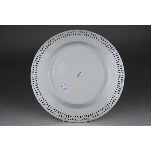 266 - A KPM cabinet plate, the pierced rim with gilt swag design on blue bars, the centre painted with a f... 