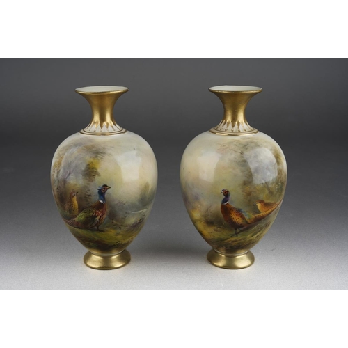 274 - A pair of Royal Worcester ovoid vases painted with cock and hen pheasants on an ivory ground by Jame... 