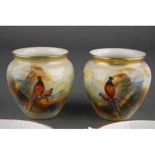 275 - A pair of Royal Worcester squat baluster vases painted with cock and hen pheasants, one signed A. Wa... 
