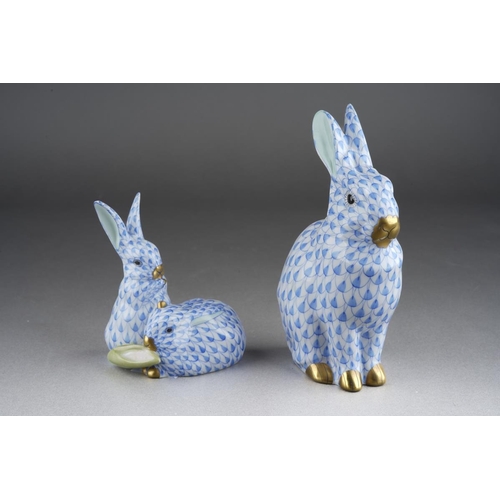 290 - Two Herend blue fish scale rabbit figures, comprising a seated rabbit, height 13cm approx and two ra... 