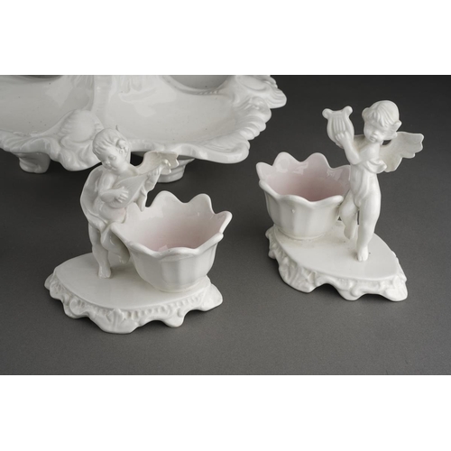 297 - A Capodimonte white glazed centrepiece, modelled as a scrolled foliate bowl supported atop a putti s... 