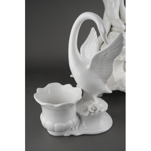297 - A Capodimonte white glazed centrepiece, modelled as a scrolled foliate bowl supported atop a putti s... 