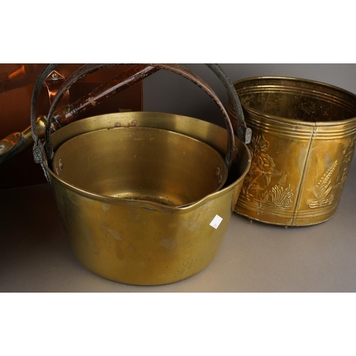 77 - A collection of copper and brassware to include: Thomas Harrison Nottingham carriage foot warmer, a ... 