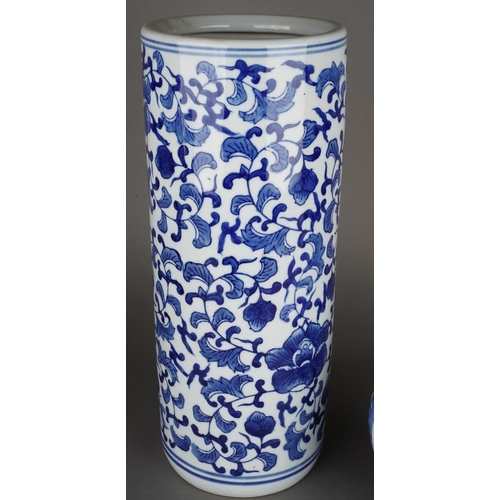 80 - A Chinese blue and white cylinder stick stand decorated with flowers, approx 38cm high and a Modern ... 