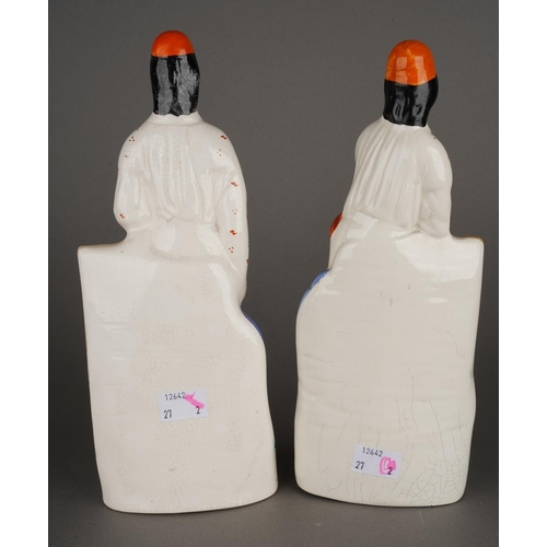 98 - A pair of Staffordshire flatback figures of Cricketeers, each with orange caps, orange and black bat... 