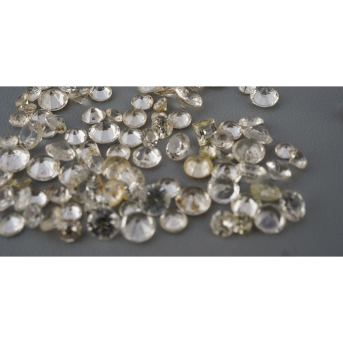 289 - A collection of colourless sapphire, synthetixc spinel and colouless paste and other colourless ston... 