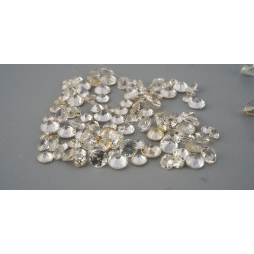 289 - A collection of colourless sapphire, synthetixc spinel and colouless paste and other colourless ston... 