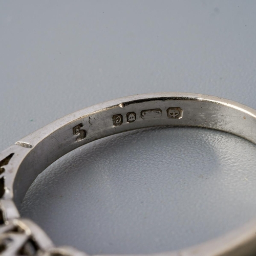 295 - A 9ct gold diamond three stone ring. Set with round brilliant cut diamonds within illusion style set... 