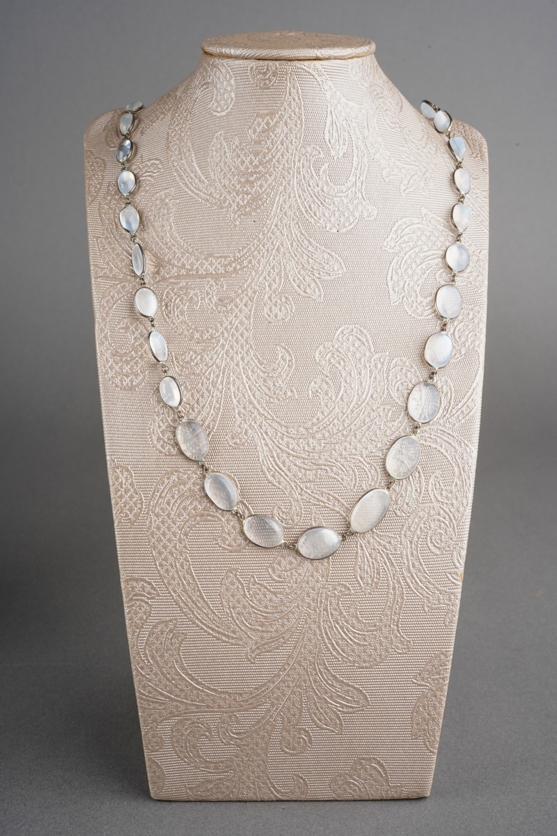 A long moonstone necklace. Designed as a series of graduating moonstone ...