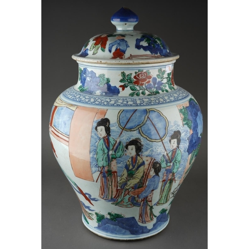 A 19th Century Kangxi style Chinese Wucai large baluster jar and cover decorated with an interior scene showing a seated Lady with attendants, two bearing fans, she watches a group of musicians and dancers., the entire with trees, foliage, flower and motifs, the cover decorated with boys amongst bamboo, approx 54cm high a/f