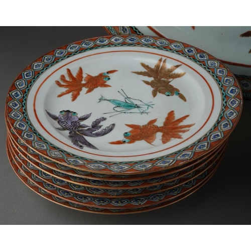 122 - A set of twelve Chinese dinner plates and matching oval platter, each decorated with carp and shrimp... 