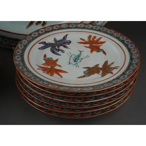 122 - A set of twelve Chinese dinner plates and matching oval platter, each decorated with carp and shrimp... 